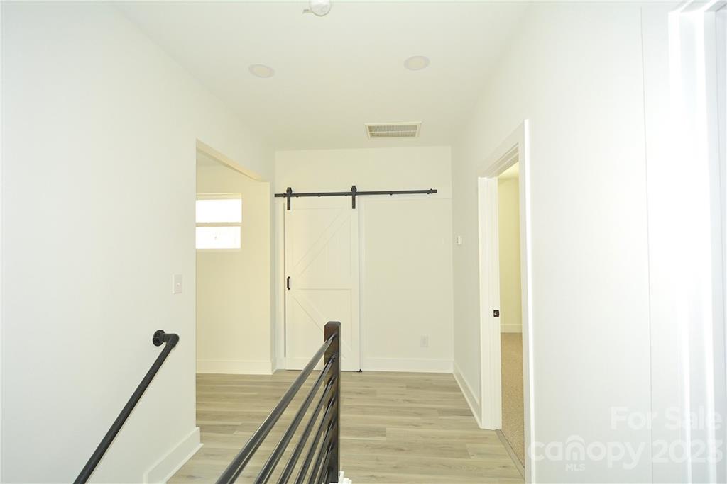 1511 Farm Road Shelby, NC 28152 - Photo 10 of 36 a view of a hallway with wooden floor