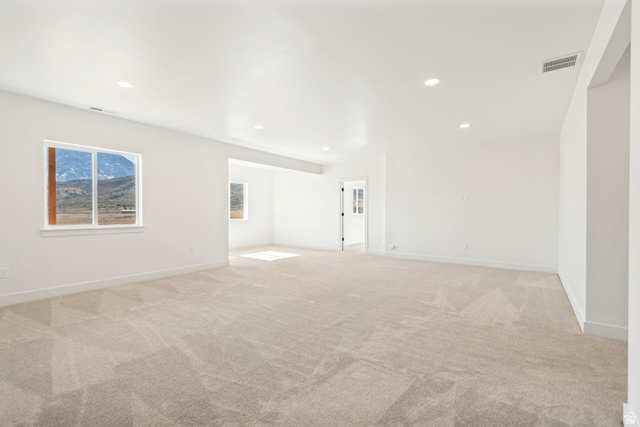 1351 Maple Circle Santaquin, UT 84655 - Photo 30 of 42 Spacious room featuring light-colored carpeting and white walls