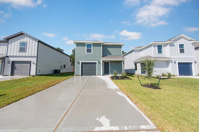 a view of house with outdoor space and swimming pool