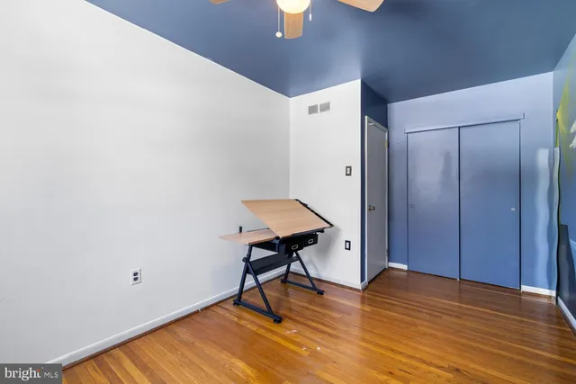 a view of a livingroom with furniture and wooden floor