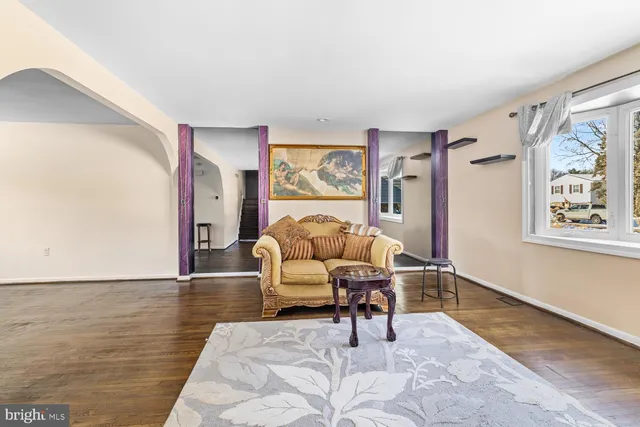 a living room with furniture and a rug