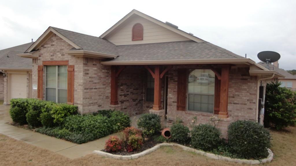 230 Kiras Court Austin, TX 78737 - Photo 2 of 10 a front view of a house with plants