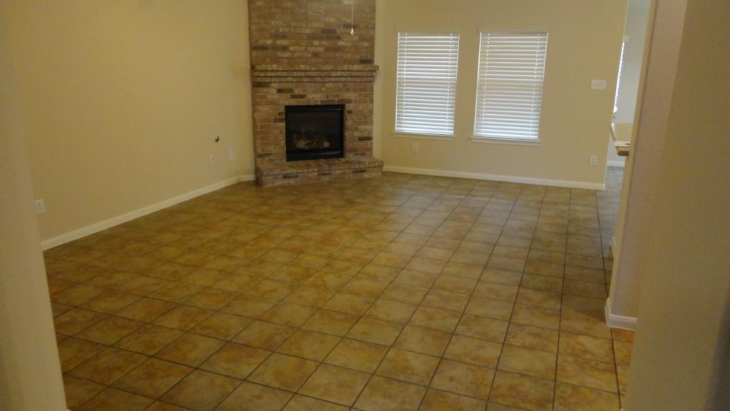 230 Kiras Court Austin, TX 78737 - Photo 8 of 10 a view of an empty room with a fireplace