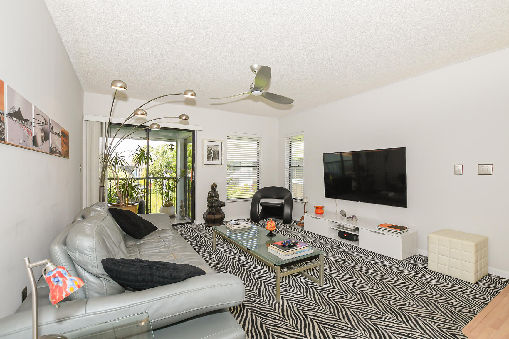 950 South Kanner Highway, Unit 905 Stuart, FL 34994 - Photo 15 of 34 a living room with furniture and a flat screen tv