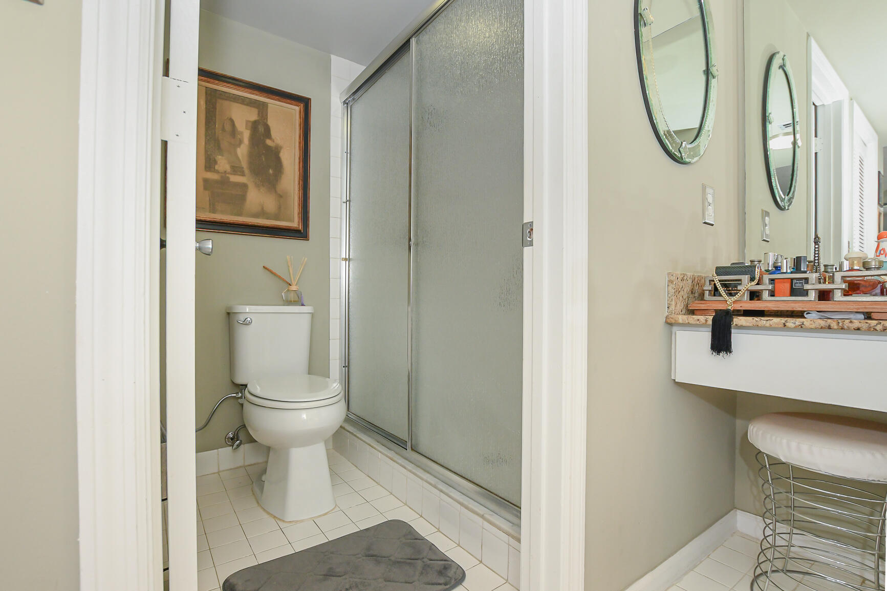 950 South Kanner Highway, Unit 905 Stuart, FL 34994 - Photo 20 of 34 a bathroom with a toilet sink and mirror