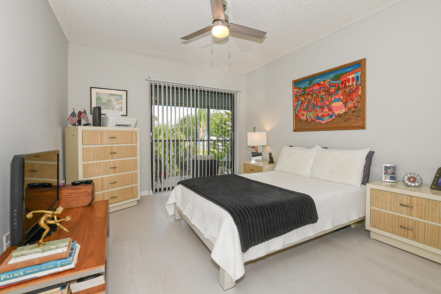 950 South Kanner Highway, Unit 905 Stuart, FL 34994 - Photo 22 of 34 a spacious bedroom with a bed and a chandelier