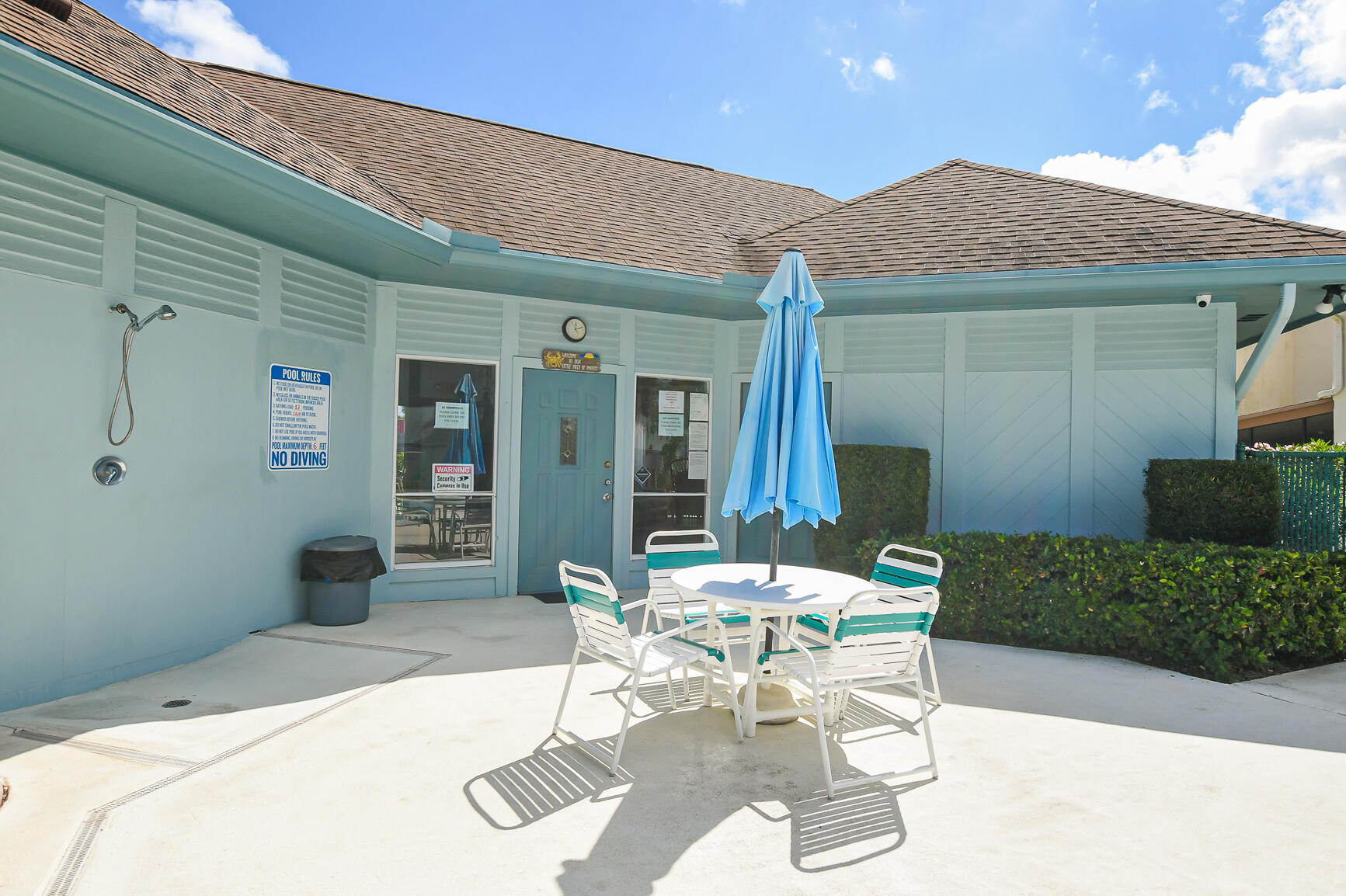 950 South Kanner Highway, Unit 905 Stuart, FL 34994 - Photo 31 of 34 a patio with a table and chairs and potted plants