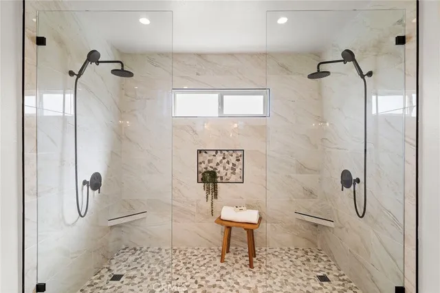 a bathroom with a shower toilet and a sink