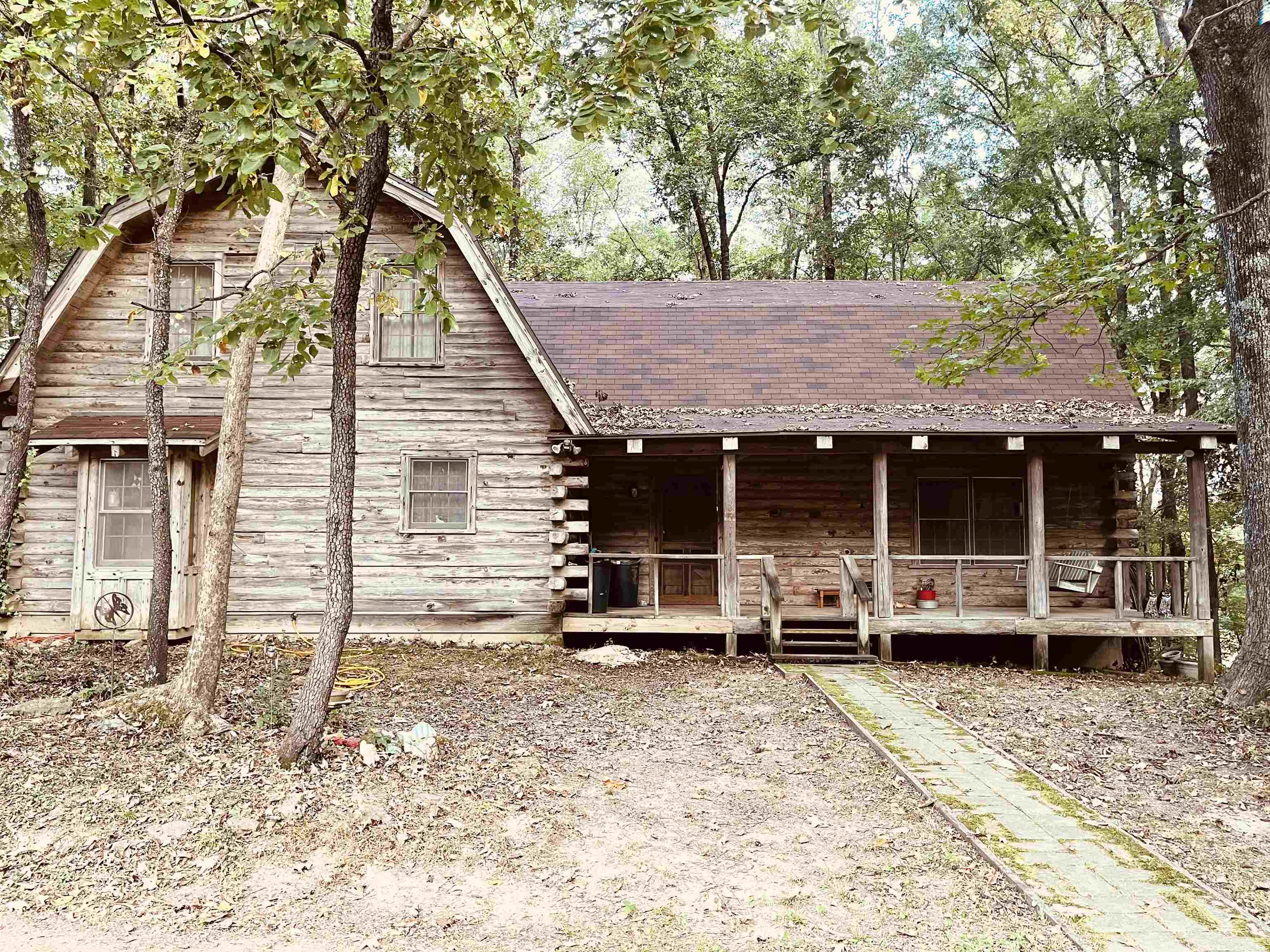 2485 Warren Road Oakland, TN 38060 - Photo 1 of 1 For your everyday retreat! This cabin nestled on 6 acres with a wired storage shop and barn and pasture is waiting for the visionary who can transform it. Move in ready or a palette waiting for your creativity to make this house a home! 2588 sf
