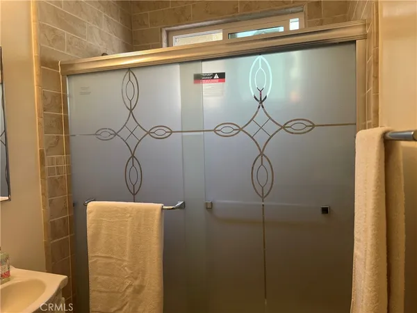 a bathroom with a shower and a shower head