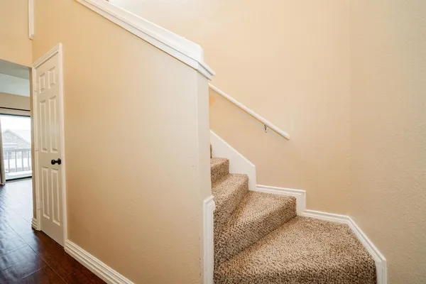 a view of a hallway with staircase