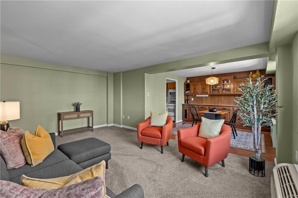 4625 Fifth Avenue, Unit 206 Pittsburgh, PA 15213 - Photo 11 of 31 a living room with furniture a lamp and a potted plant
