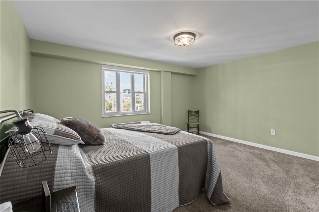 4625 Fifth Avenue, Unit 206 Pittsburgh, PA 15213 - Photo 23 of 31 a bedroom with a bed and window