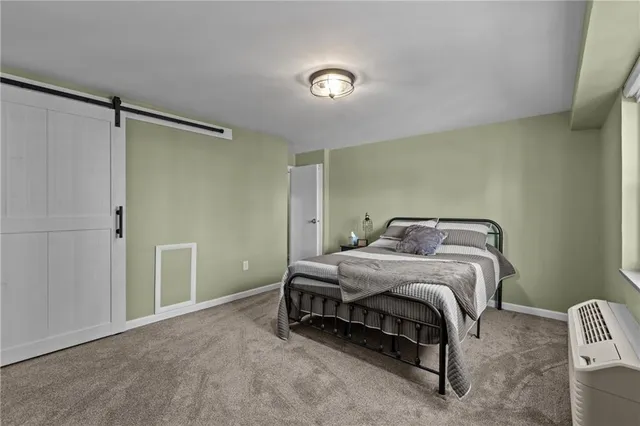 a bathroom with a sink mirror and toilet
