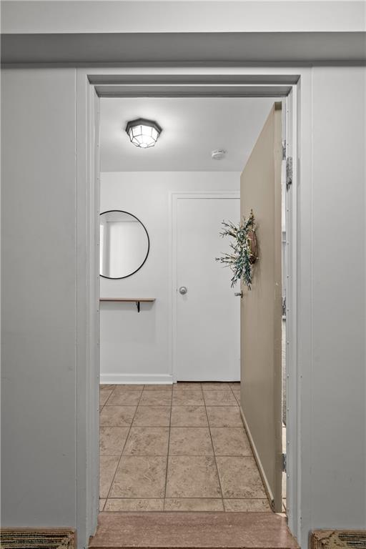 4625 Fifth Avenue, Unit 206 Pittsburgh, PA 15213 - Photo 27 of 31 a view of a hallway with wooden floor