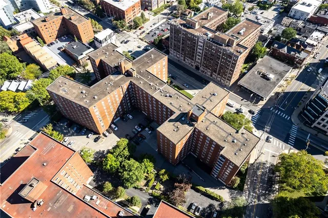 an aerial view of residential houses with outdoor space