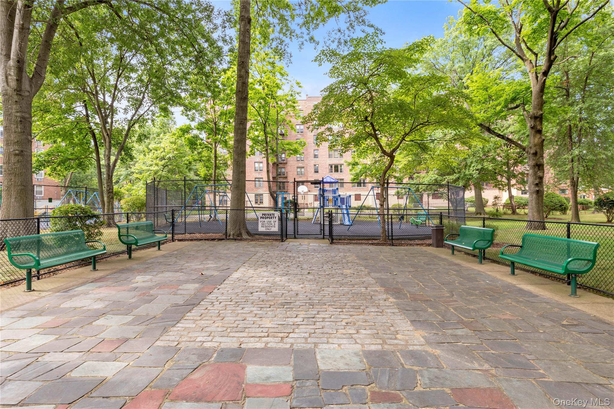 209-20 18th Avenue, Unit 6C Queens, NY 11360 - Photo 13 of 15 a view of a park with large trees
