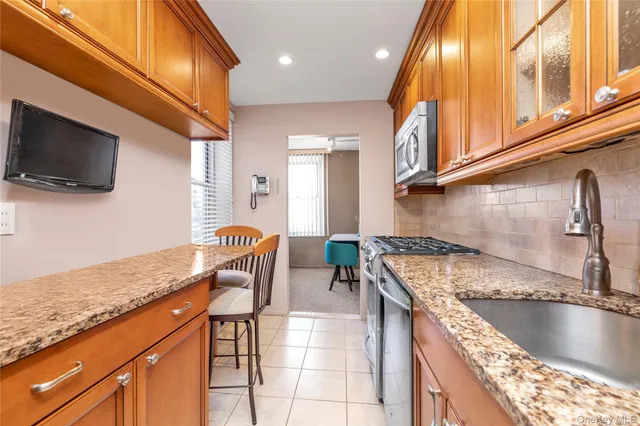 a kitchen with granite countertop lots of counter top space