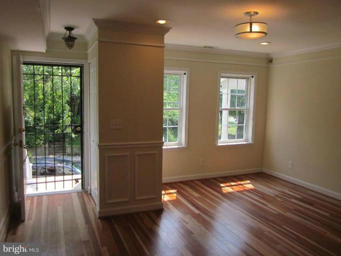 1416 Morris Road Southeast Washington, DC 20020 - Photo 3 of 12 Sun-filled foyer and living room.