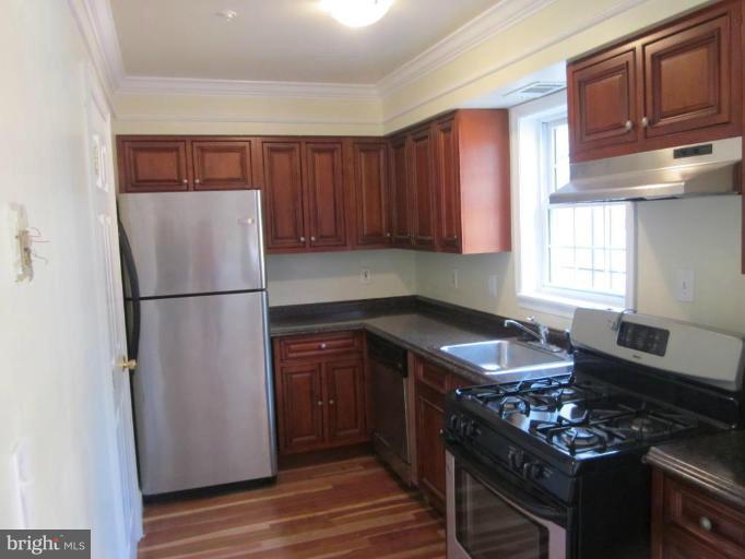 1416 Morris Road Southeast Washington, DC 20020 - Photo 4 of 12 Renovated kitchen with stainless steel appliances.