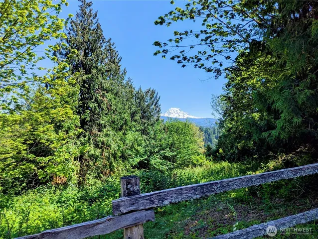 a view of a balcony with a tree