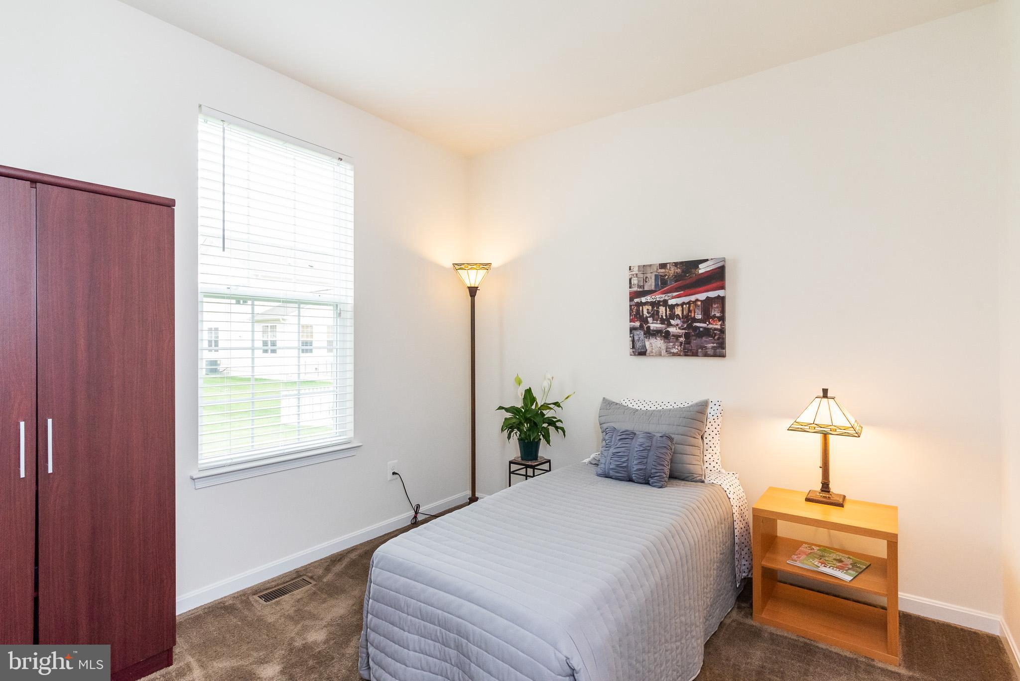 709 Daft Road Baltimore, MD 21220 - Photo 22 of 48 a bedroom with a bed and a window