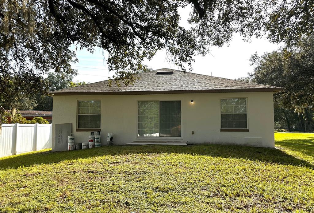 1758 Clarcona Road Apopka, FL 32703 - Photo 20 of 20 a front view of a house with a garden