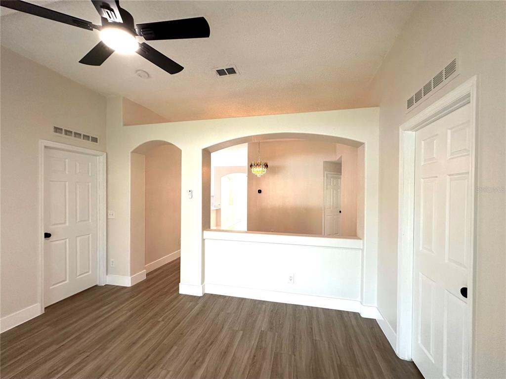 1758 Clarcona Road Apopka, FL 32703 - Photo 9 of 20 a view of a hallway with wooden floor