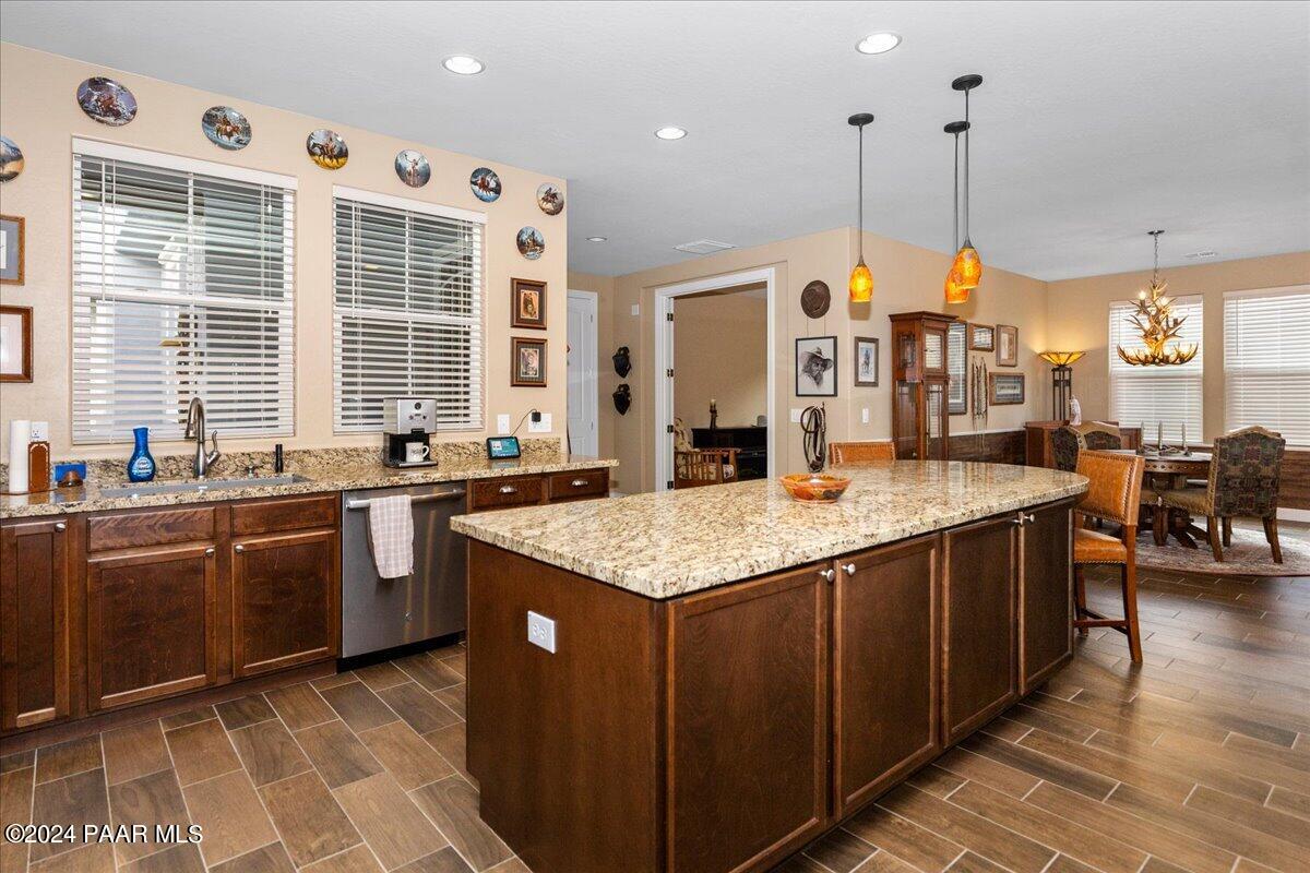2206 Calgary Drive Prescott, AZ 86301 - Photo 11 of 54 a kitchen with stainless steel appliances granite countertop a stove a sink dishwasher and a refrigerator
