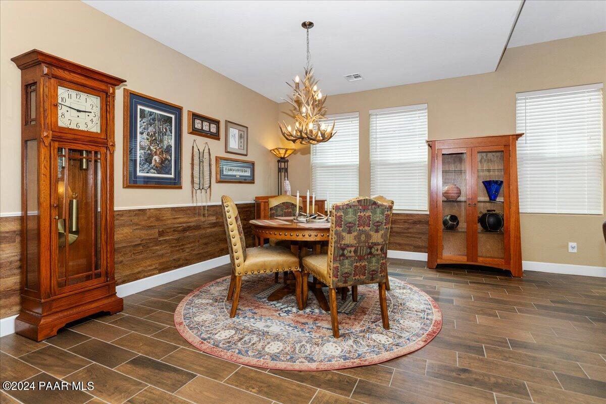 2206 Calgary Drive Prescott, AZ 86301 - Photo 12 of 54 a dining room with wooden floor and chandelier