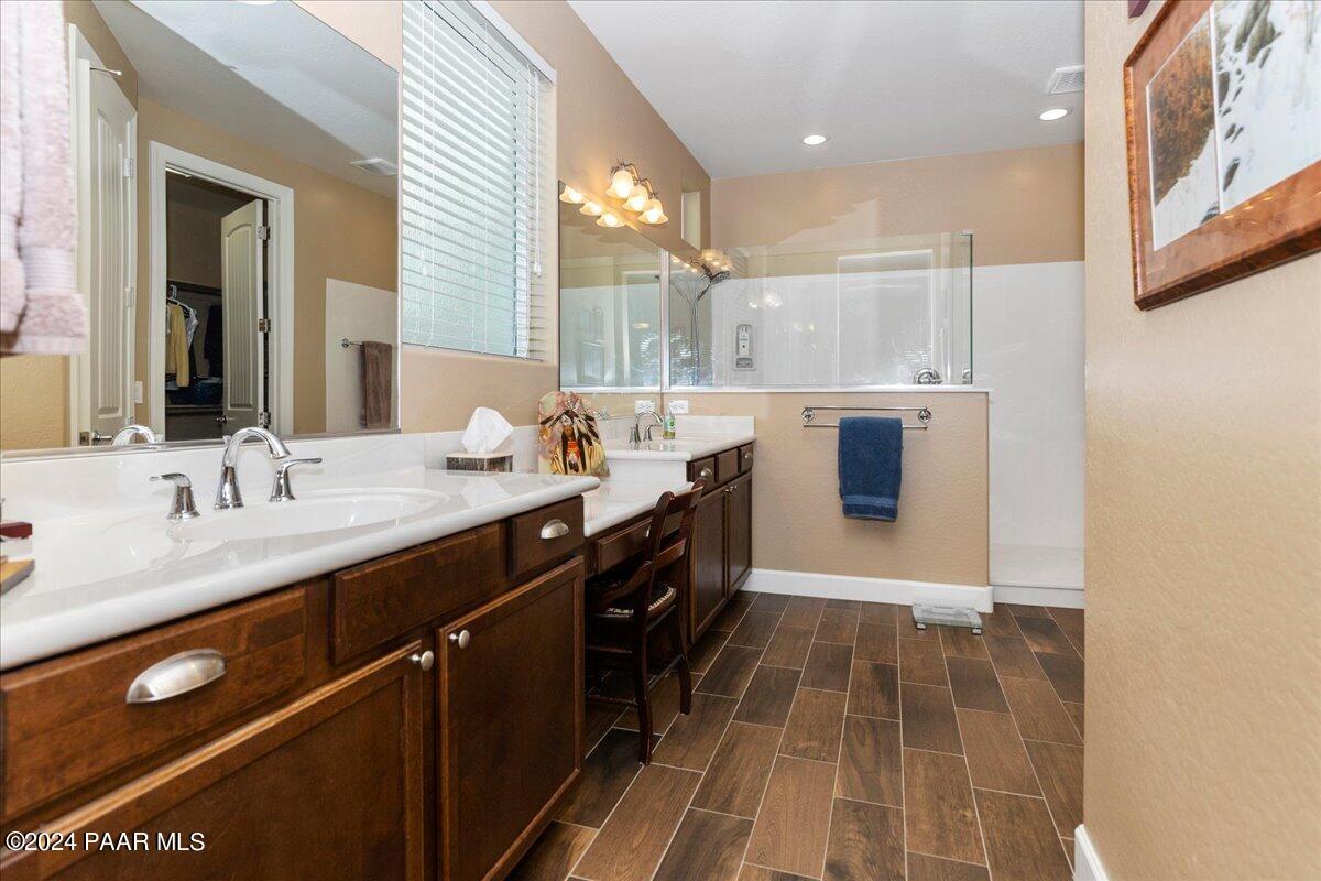 2206 Calgary Drive Prescott, AZ 86301 - Photo 16 of 54 a spacious bathroom with a double vanity sink a mirror and a shower
