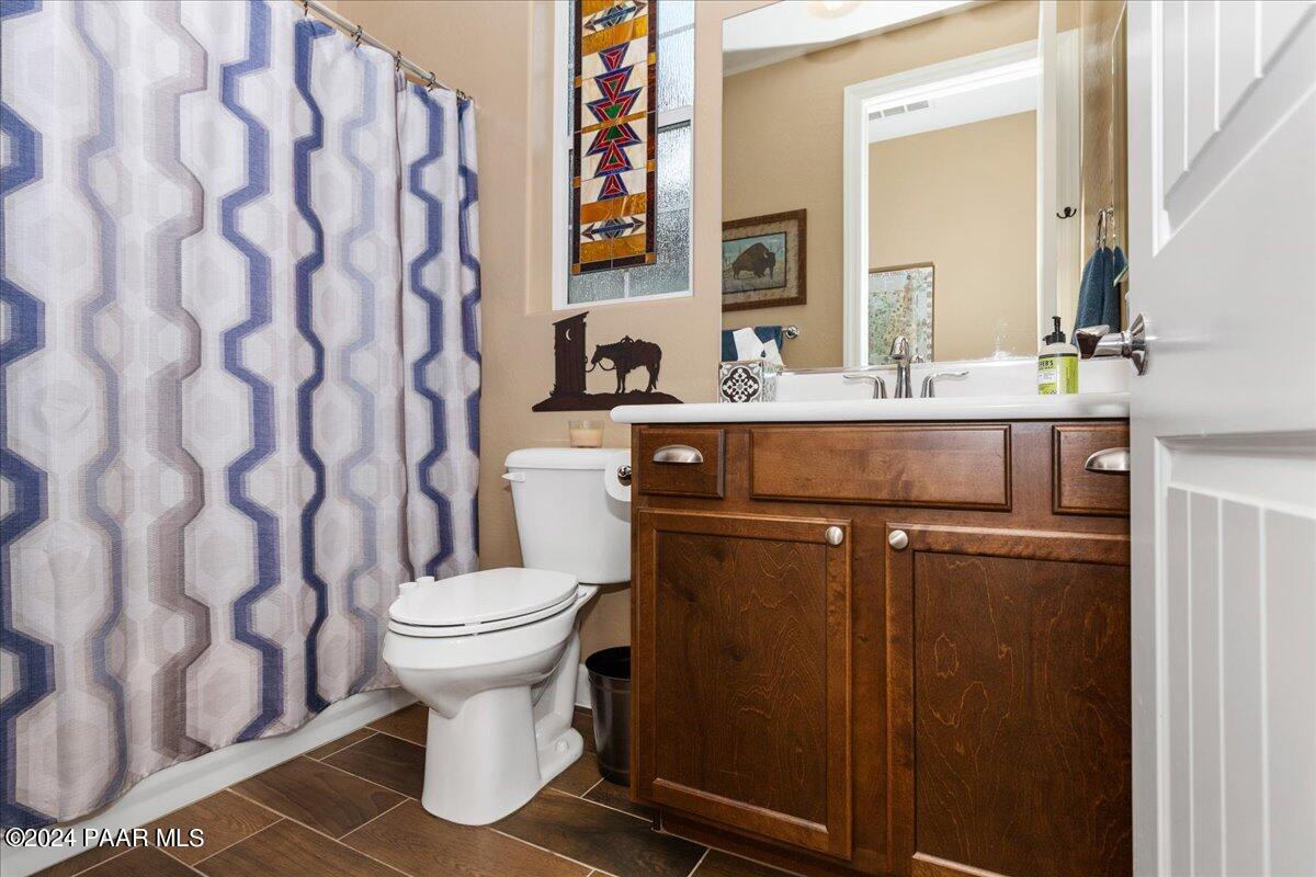2206 Calgary Drive Prescott, AZ 86301 - Photo 21 of 54 a bathroom with a sink toilet and mirror