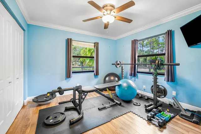 a room with gym equipment and window