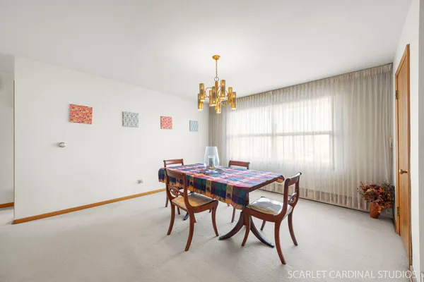 a dining room with furniture and window