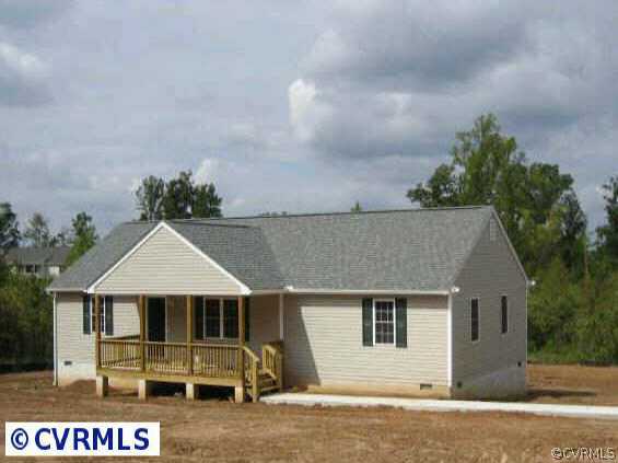 2225 Turkey Island Road Crewe, VA 23930 - Photo 1 of 6 a front view of a house with a garage