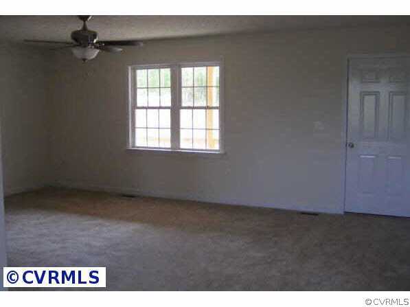 2225 Turkey Island Road Crewe, VA 23930 - Photo 2 of 6 an empty room with a window