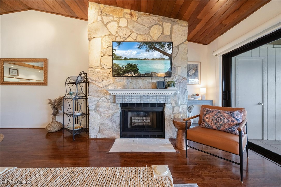 16650 Partridge Place Road, Unit 204 Fort Myers, FL 33908 - Photo 2 of 47 a living room with furniture and a fireplace