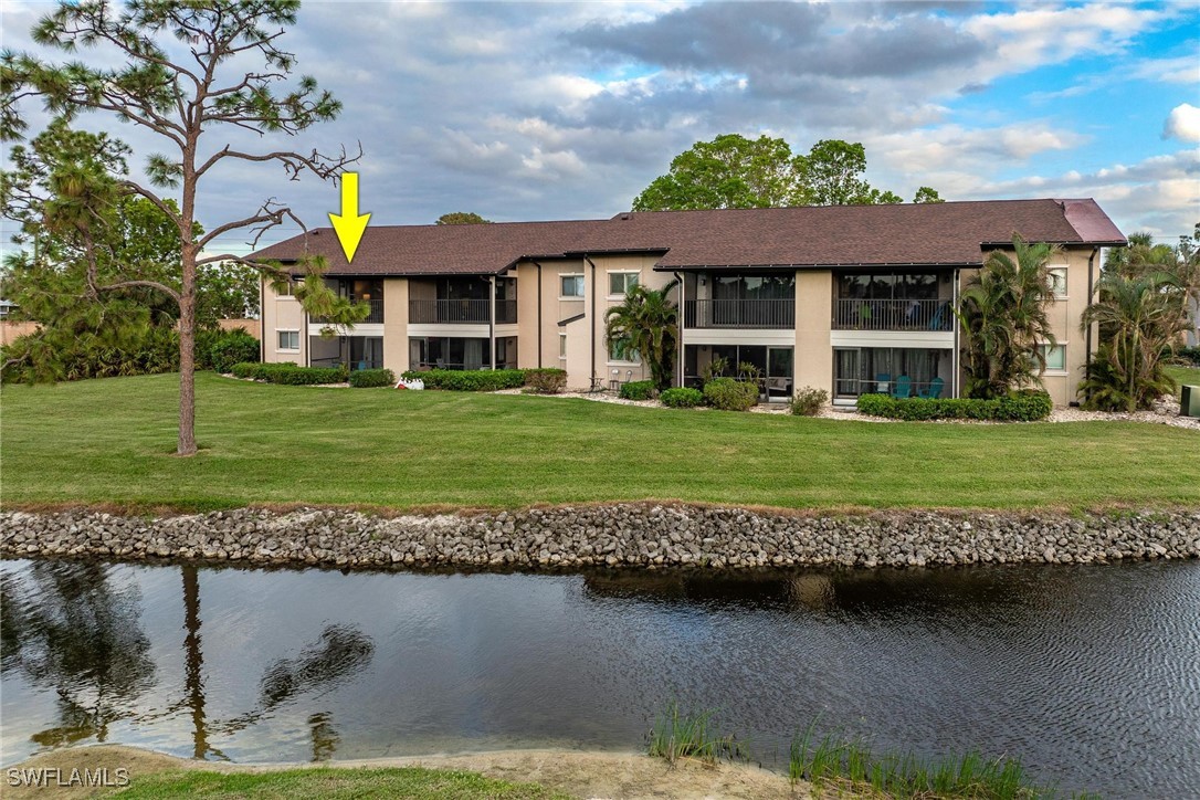 16650 Partridge Place Road, Unit 204 Fort Myers, FL 33908 - Photo 30 of 47 a view of a house with a yard