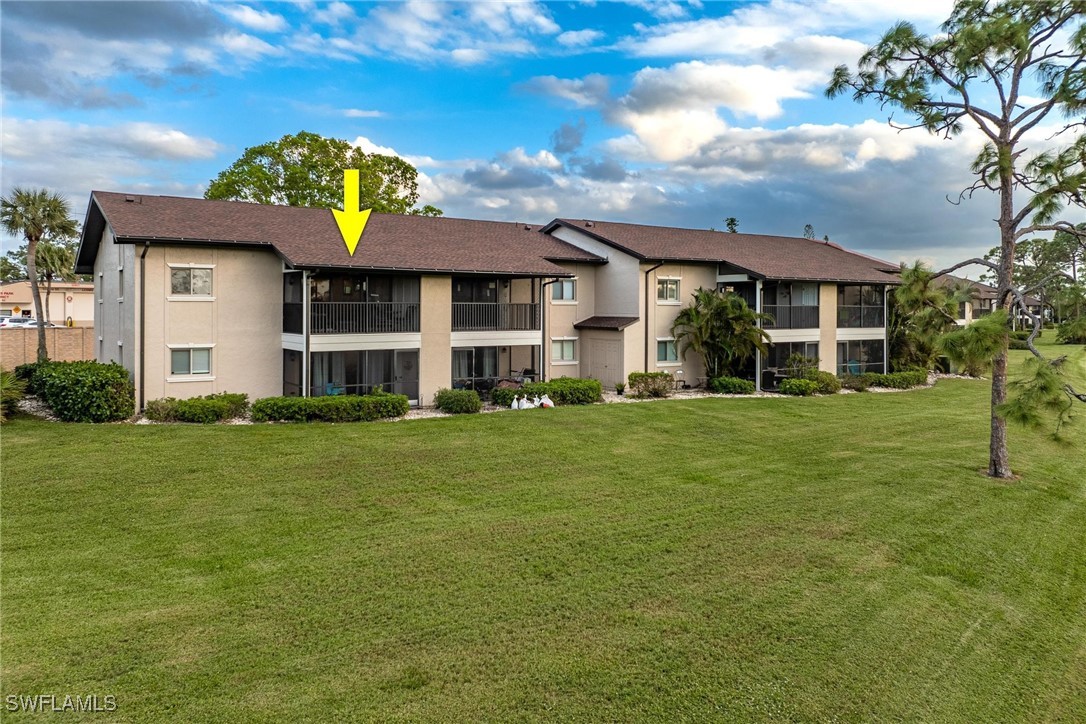 16650 Partridge Place Road, Unit 204 Fort Myers, FL 33908 - Photo 31 of 47 a front view of a house with a garden