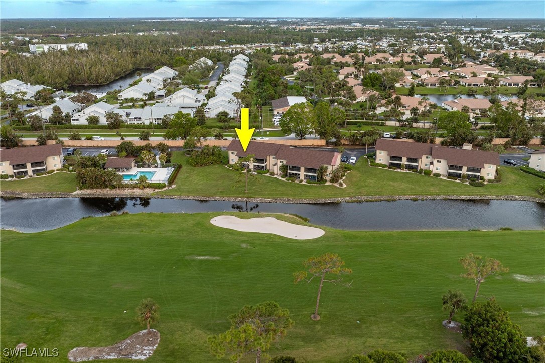 16650 Partridge Place Road, Unit 204 Fort Myers, FL 33908 - Photo 32 of 47 an aerial view of residential houses with outdoor space