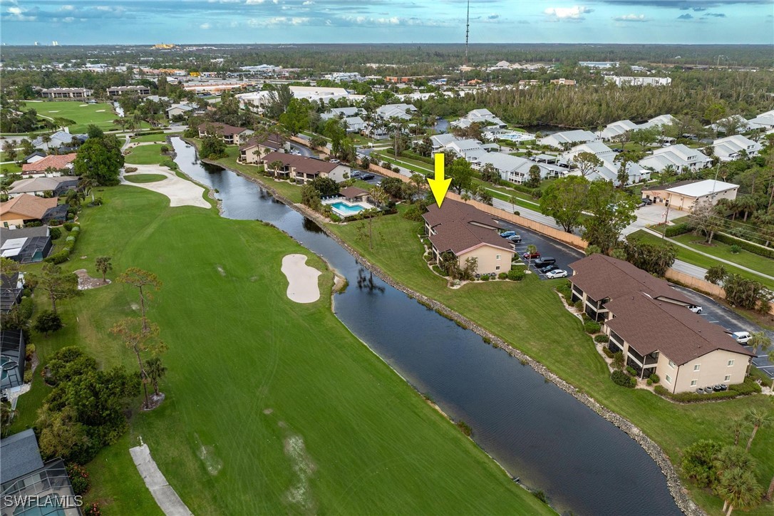 16650 Partridge Place Road, Unit 204 Fort Myers, FL 33908 - Photo 33 of 47 an aerial view of residential houses with outdoor space