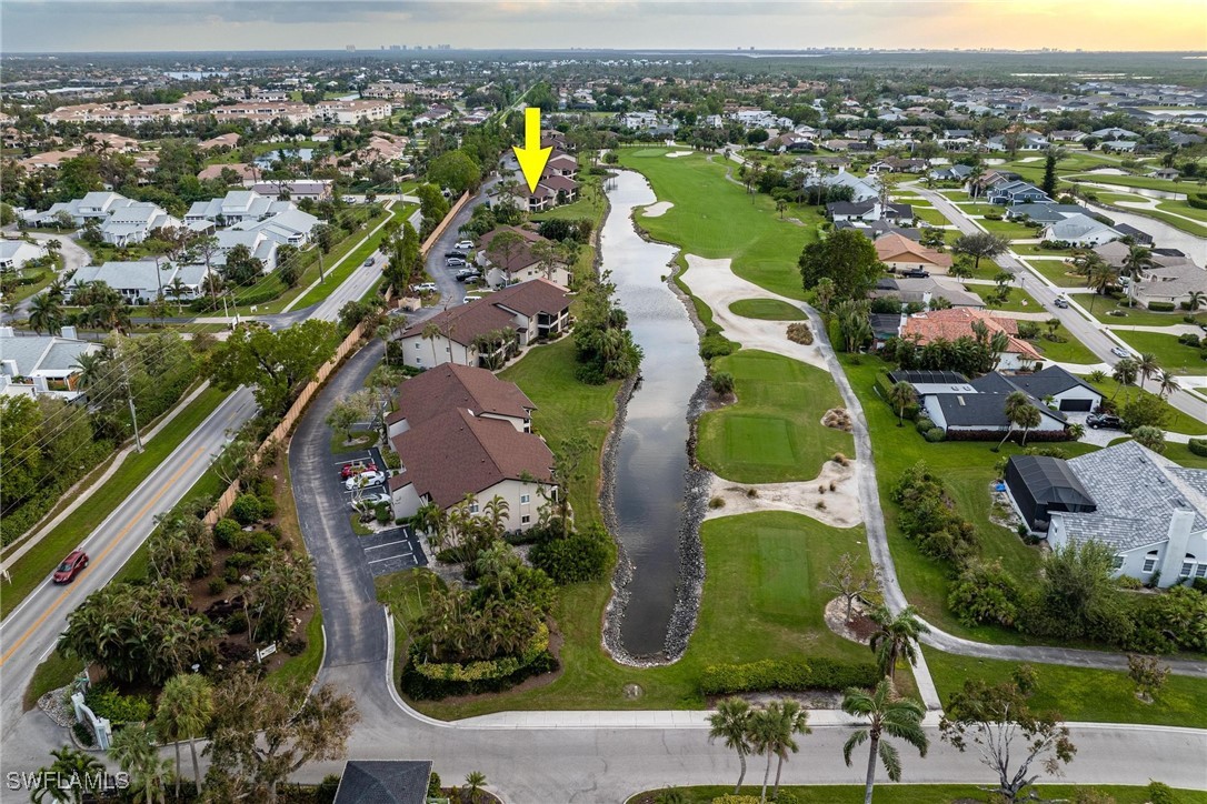 16650 Partridge Place Road, Unit 204 Fort Myers, FL 33908 - Photo 34 of 47 an aerial view of residential houses with outdoor space