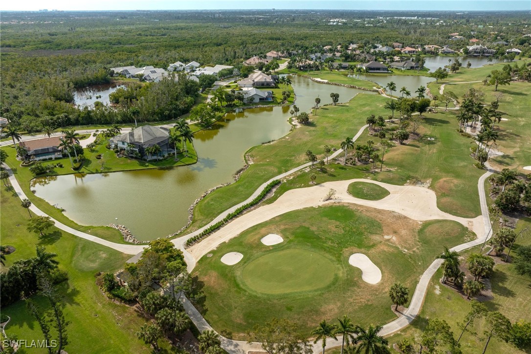16650 Partridge Place Road, Unit 204 Fort Myers, FL 33908 - Photo 39 of 47 a view of a lake with a yard