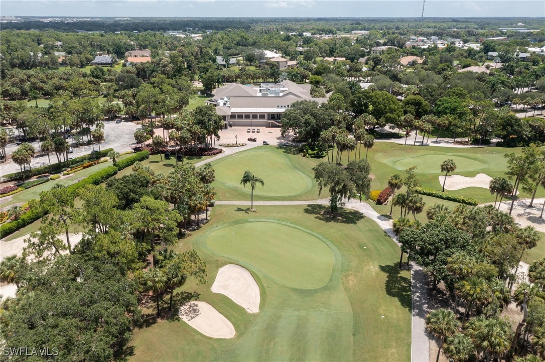 16650 Partridge Place Road, Unit 204 Fort Myers, FL 33908 - Photo 4 of 47 an aerial view of a house with a yard and lake view