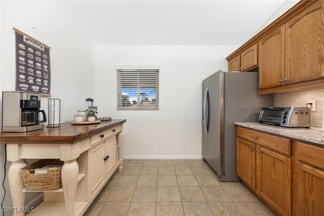 16650 Partridge Place Road, Unit 204 Fort Myers, FL 33908 - Photo 10 of 47 a kitchen with stainless steel appliances a sink cabinets and a window