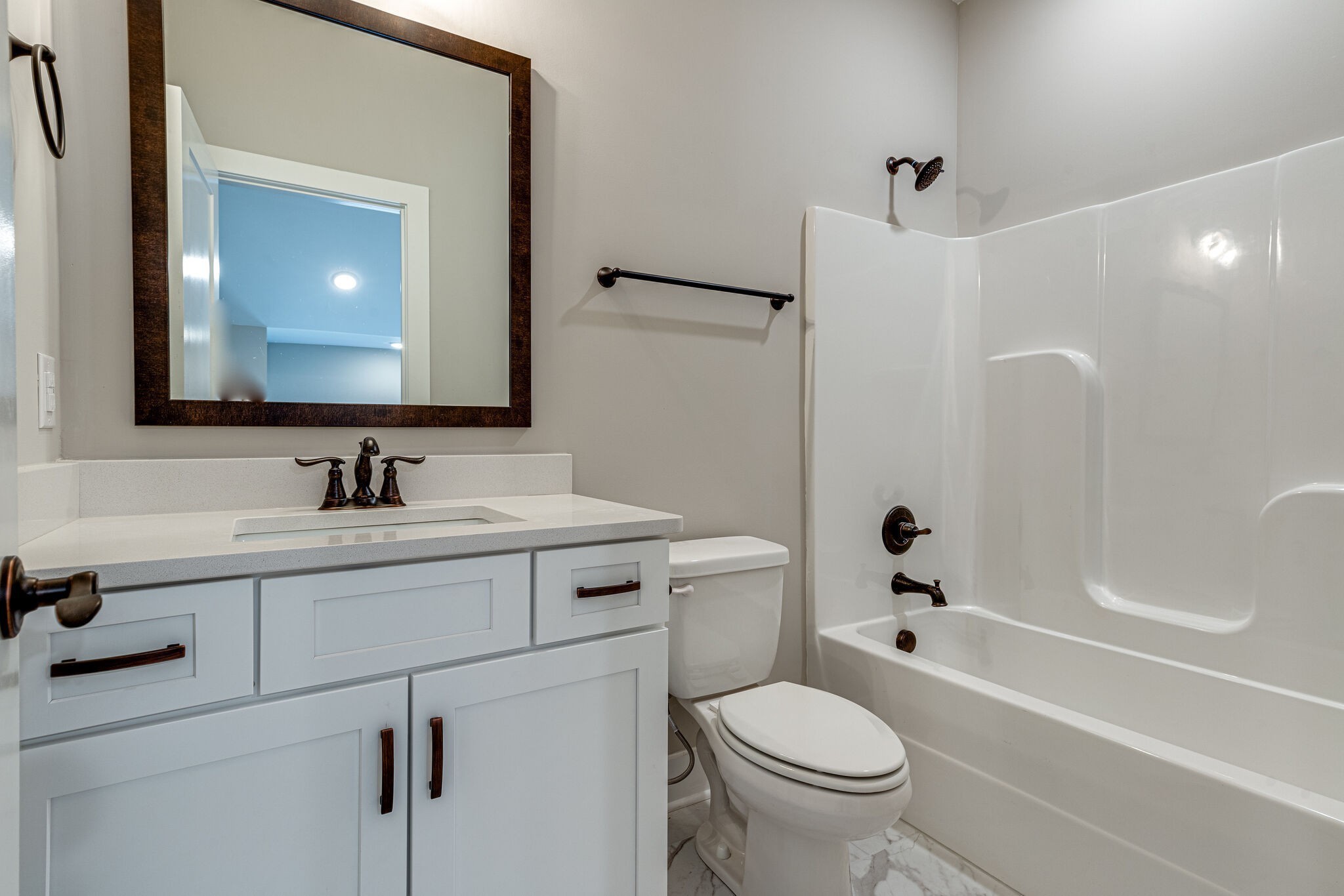 1024 Sycamore Ridge West, Unit 43 Burns, TN 37029 - Photo 49 of 59 a bathroom with a sink toilet vanity and tub