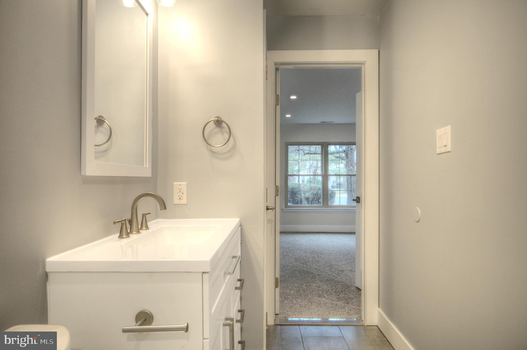 14 Pickwick Place Sewell, NJ 08080 - Photo 28 of 36 a bathroom with a sink and a mirror