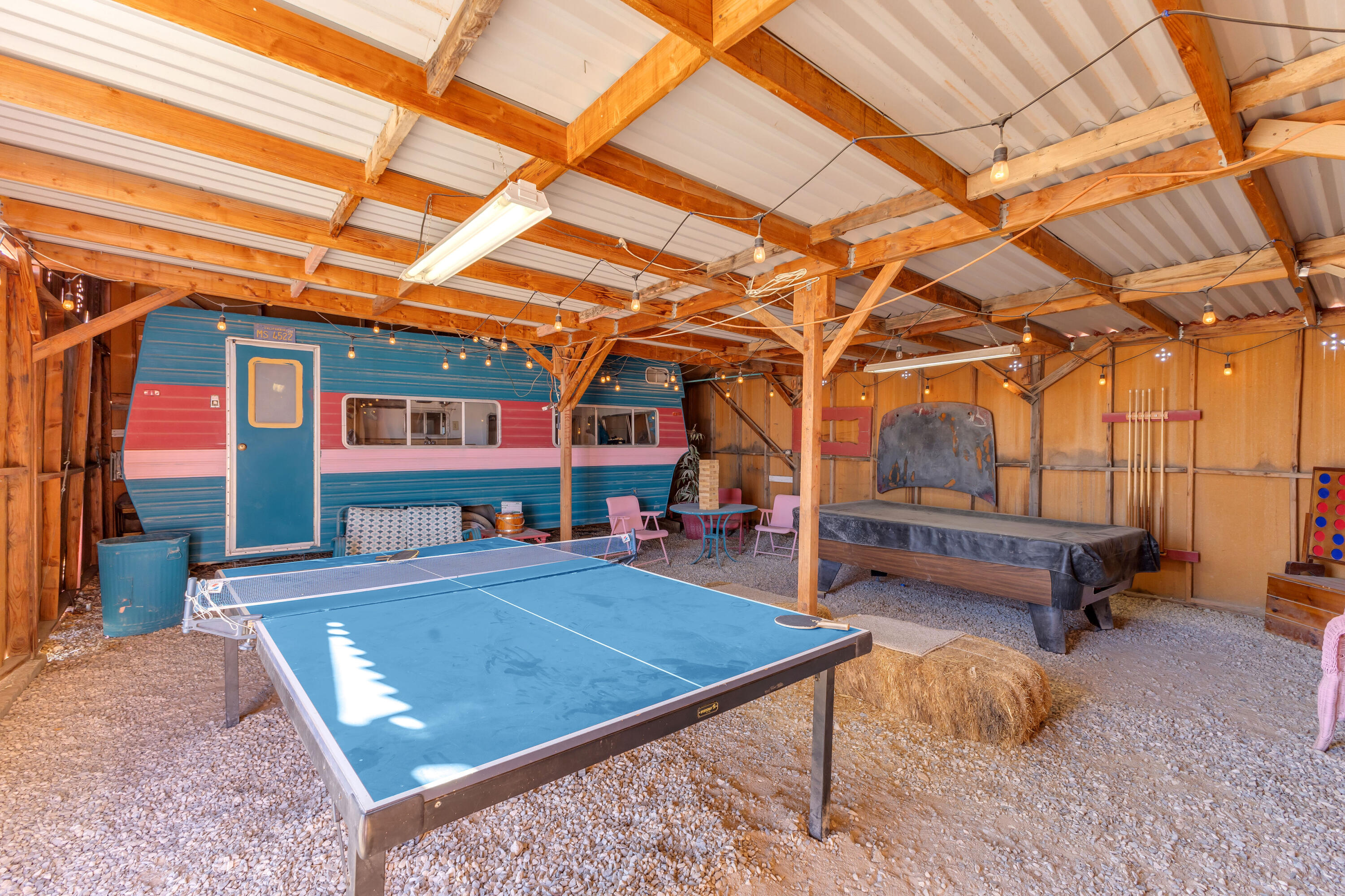 2642 Star Lane Joshua Tree, CA 92252 - Photo 56 of 76 a view of a backyard with a patio and outdoor seating
