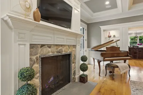 a living room with furniture and a fireplace