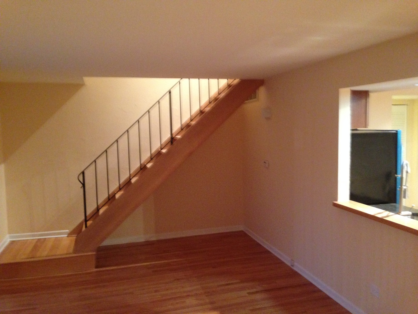 672 Cleo Court Wheeling, IL 60090 - Photo 9 of 20 a view of a hallway with wooden floor and staircase